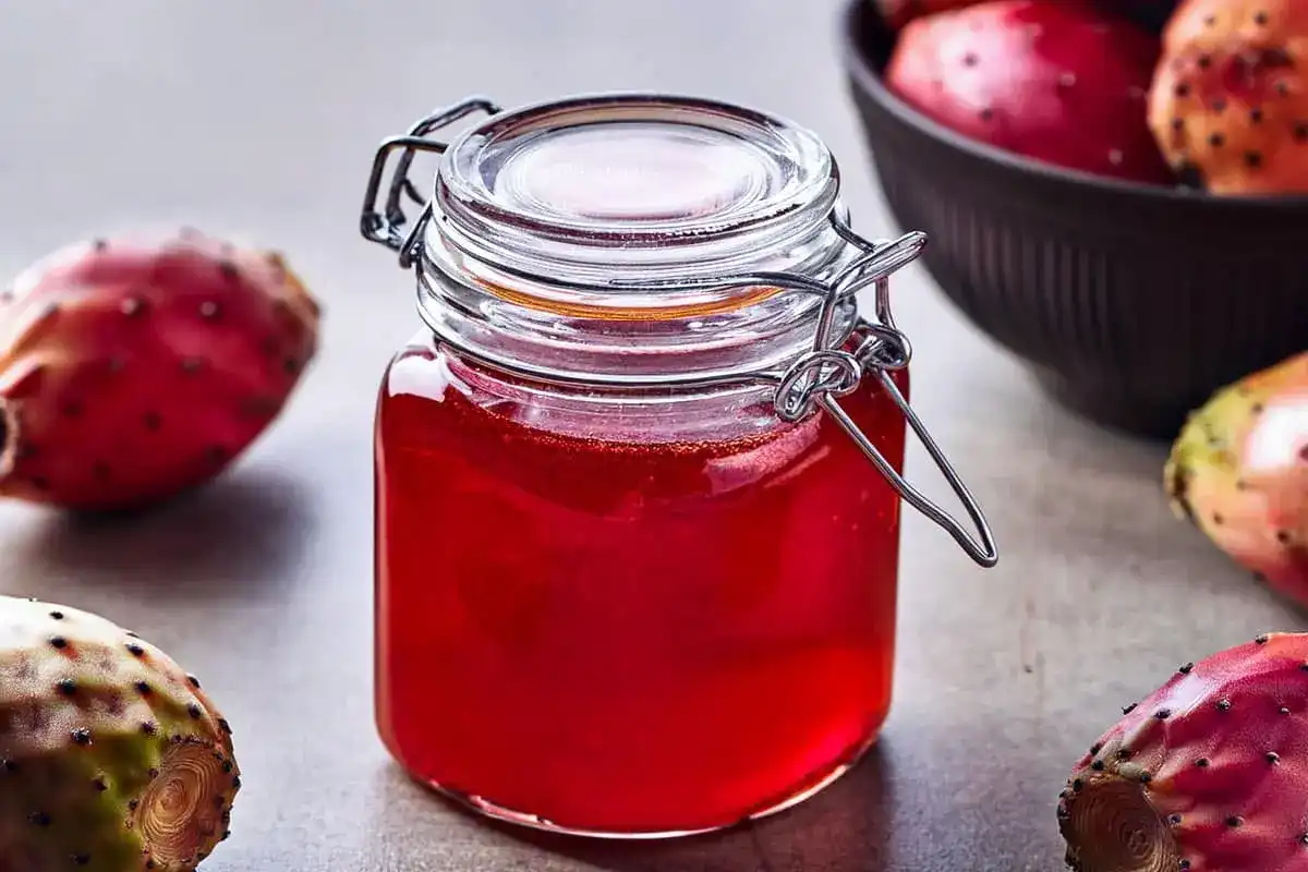 A jar of finished prickly pear syrup