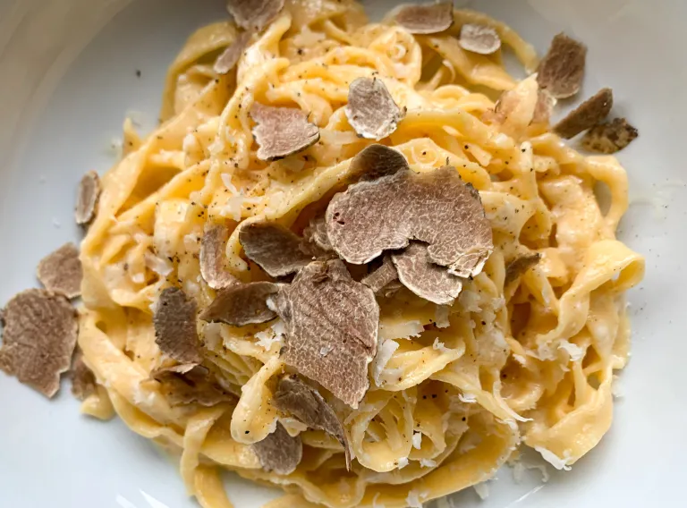 A beautifully plated dish with white truffles